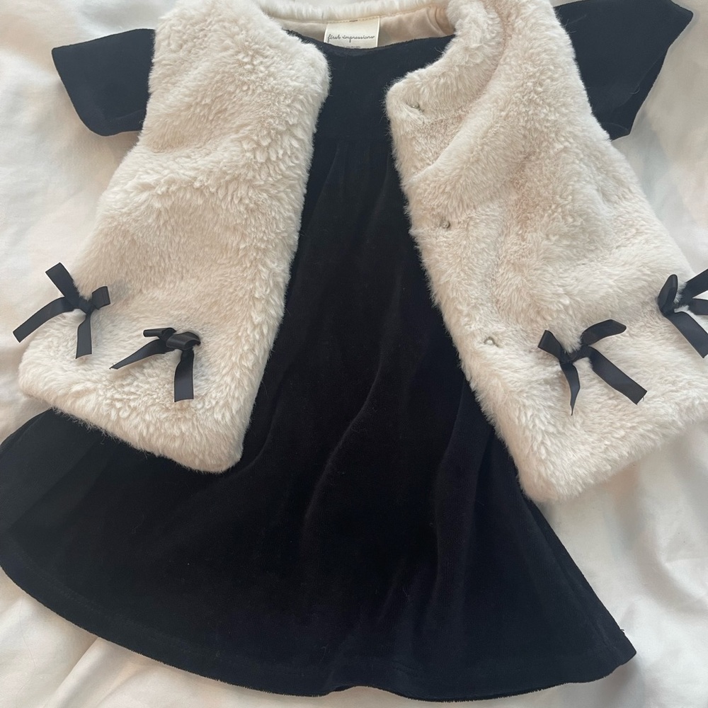 black velvet dress and white faux fur vest